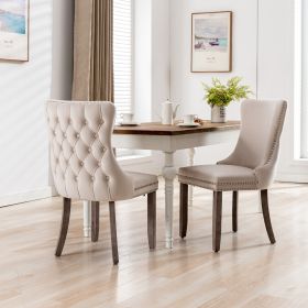 A A Upholstered Wing-Back Chair With Nailhead Trim & Solid Wood Leg (Color: Beige)